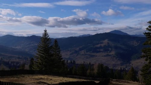 Clouds Slowly Gliding Over Forest On The Mountains At Dusk. Timelapse