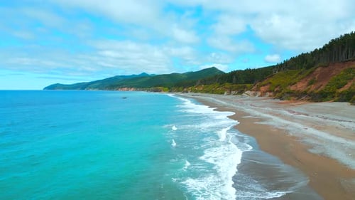 Top view of beautiful coast with turquoise water. Clip. Amazing coastline landscape with turquoise