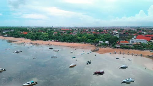 Aerial Panorama: Sanur Beach, Boats, and Town (Bali Footage)