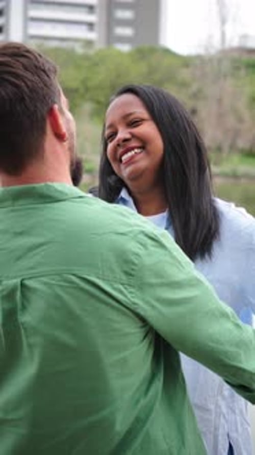 Couple Share Affectionate Embrace in Urban Park