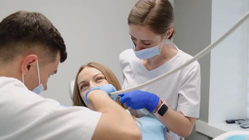 Woman Receiving Dental Exam at the Dentist Office