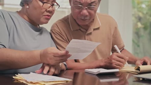 Senior Couple Managing Finances at Home