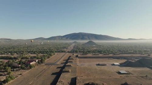 Aerial Shot Of Teotihuacan City of Gods, Aztec Pyramids, Hot Air Balloons In Background, Mexico