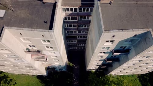Top down view and descend on communistic soviet architecture getto building