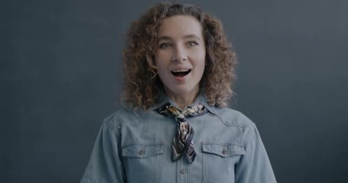 Smiling Woman in Denim Shirt and Scarf