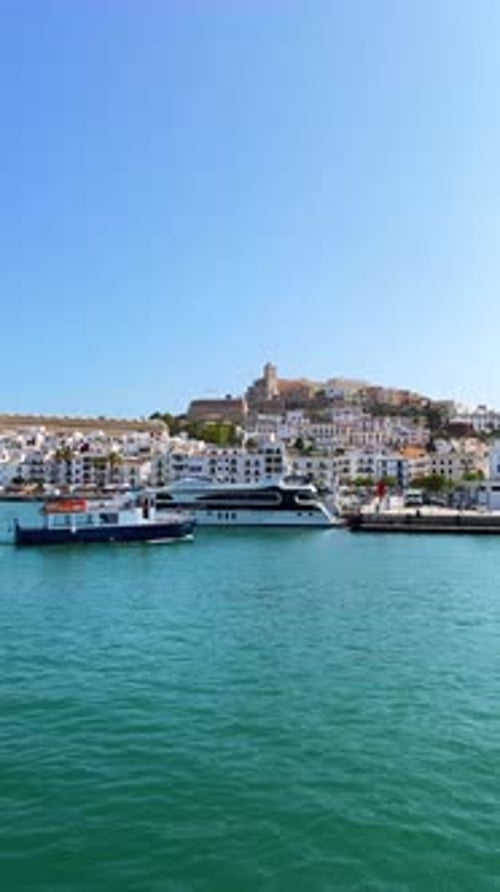 Vertical travel vlog Departing Port d'Evissa, views of Dalt Vila old town and Ibiza Castle and