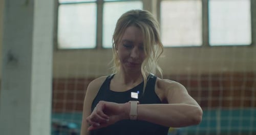 Woman in Gym Checking Incoming Notification on Smart Watch Incoming Text Message Received on Smart