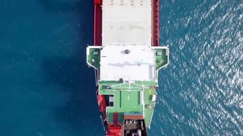 Large Cargo ship anchored away from port, Aerial view