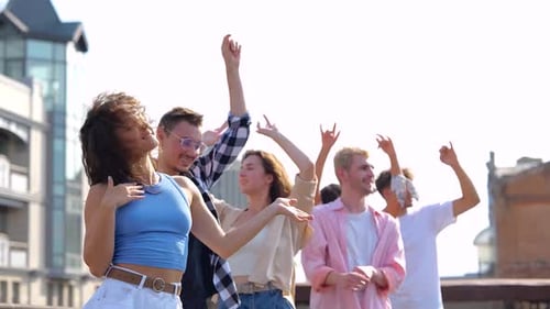 Heerful Young People Dancing While Enjoying Party Time on the Roof Terrace Building on the