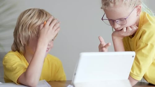 Sister Helps Little Brother Do School Homework at Home Distance Learning Online Education Boy and