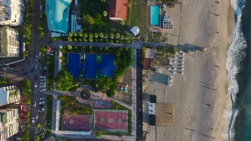 Aerial View Paddle Courts Near the Mediterranean Host Dynamic Matches and Lessons with Panoramic Sea