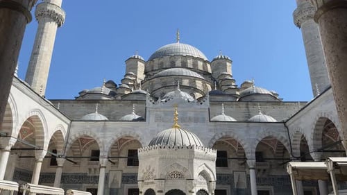 Push in between pillars to reveal center of Suleymaniye Mosque at midday