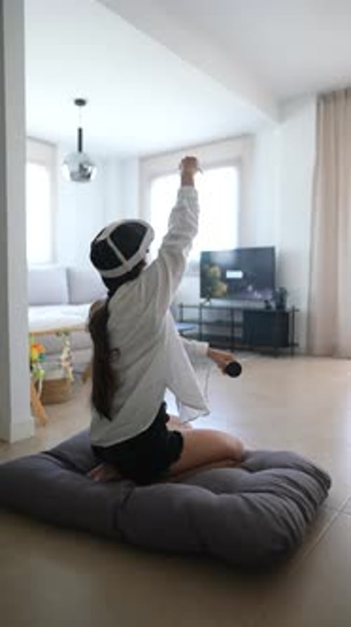 Woman Plays Virtual Reality Game with Headset