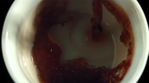 Pouring Hot Tea Into Small Ceramic Cup