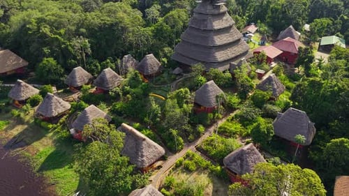 Lush Vegetation Surrounds Napo Wildlife Center Ecolodge and Its Several Cabins with Thatched Roofs