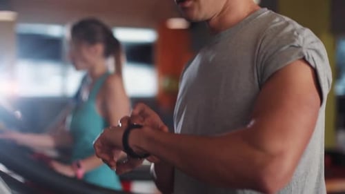 Smile Young Man Use Smartwatch on a Treadmill Gym Sport Technology Fit Lifestyle Male Workout