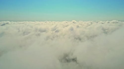 Above the clouds with blue horizon