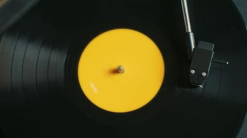 Black Vinyl Record Spinning on Turntable