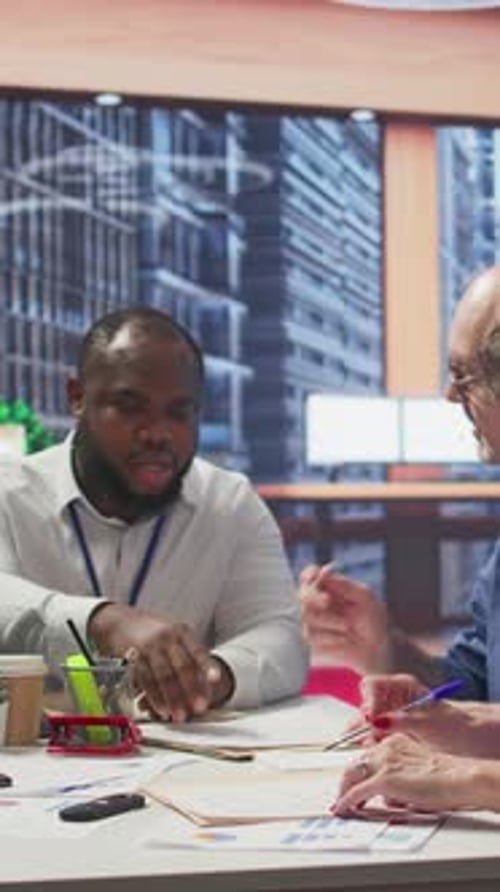 Vertical Video Elderly Woman Shaking Hands with Financial Broker in Modern Office