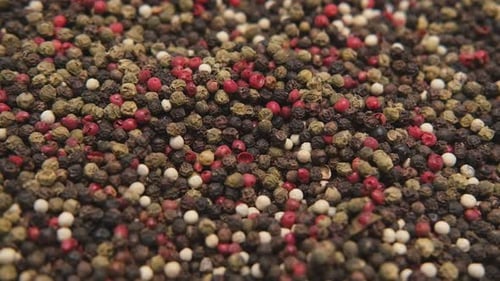 Close-up of Mixed Black, Red, and White Peppercorns