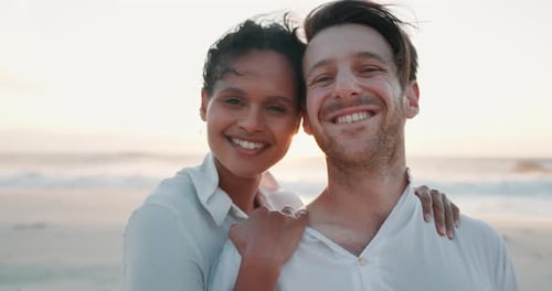 Loving Couple Embraces on Beach at Sunset