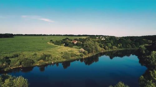Pond Among Fields and Forest