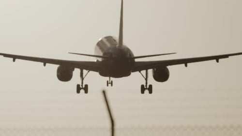 Airplane Flying Overhead to Land at Airport in Slow Motion