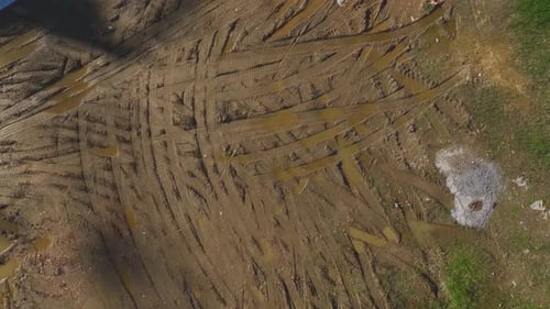 Aerial Video Tractor Trails on a Plowed Field Creating Patterns Captured From Above As a Background