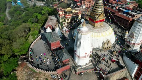 Aerial panoramic view of Swayambhunath temple, ancient buddhist monastery with hanging prayer flags,