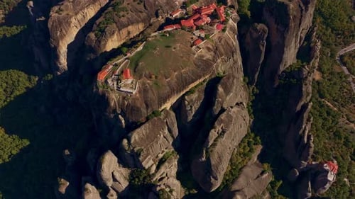 Aerial view of monasteries on rocks amidst mountains, Greece.