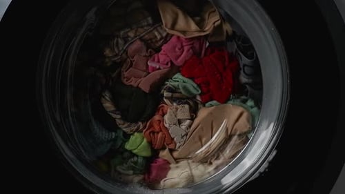 Clothes Tumble in Modern Washing Machine Drum