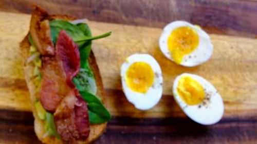 Avocado Toast and Eggs on Wooden Board