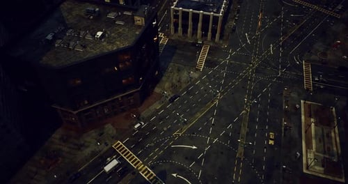 Urban Intersection Viewed From Above During Nighttime in a Busy City