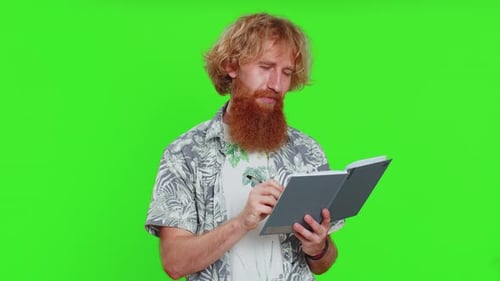 Man Writing and Speaking in Front of Green Screen