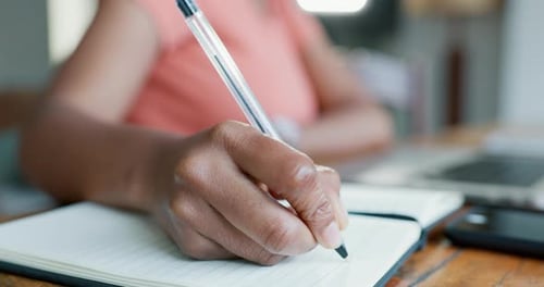 Writing in a Notebook Close Up