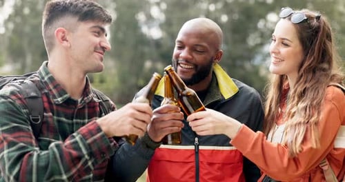 Friends, cheers and group of people with beer at party together in a forest happy