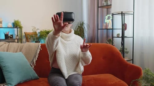 Young Adult Using VR Headset at Home