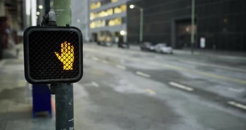 Traffic Signal Showing Caution in a Quiet Urban Street at Dusk