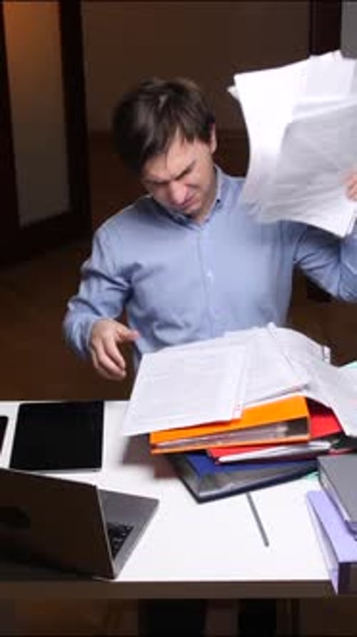 Vertical Video Stressed Office Worker Throwing Papers in the Air in Frustration