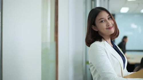 Portrait of Asian business woman is smiling in office