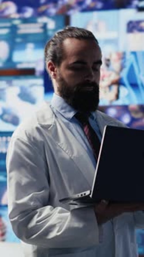 Scientist Working With Laptop in Laboratory