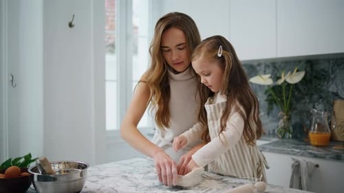 Tender Family Cooking Cake at Home Close Up