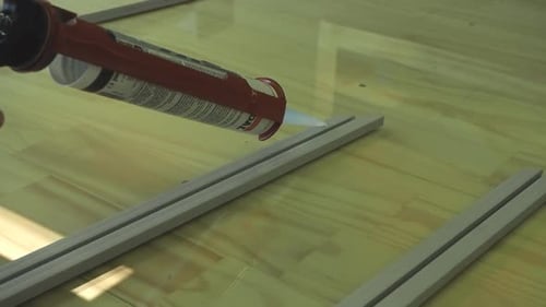 Art creating Acrylic prints of photographs in studio for artist wall art.