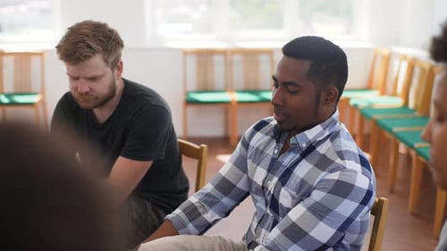 Young Adults Talking in Group Support Meeting