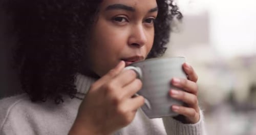 Woman Drinking Coffee in Urban Setting
