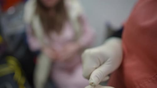 Breaking open a medical vial in hospital close up