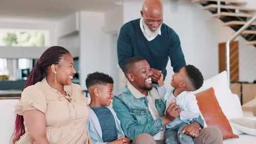 Cheerful Family Relaxing Together on Couch at Home