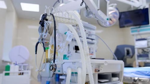 Tubes, wires, plugs and stethoscope hanging on the holder in medical ward.