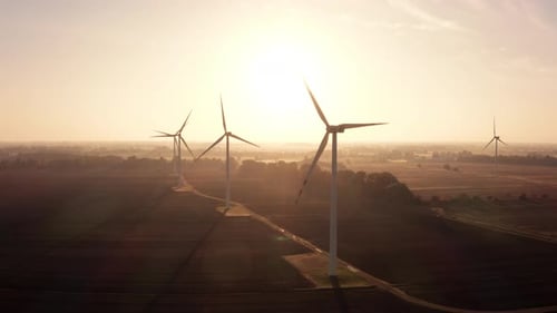 Aerial View of a Wind Farm During Sunrise in the Countryside