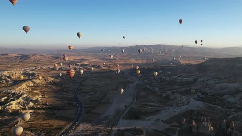 Aerial View of Hot Air Balloons Above Magical Landscape of Cappadocia, Turkey on Sunny Morning, Dron